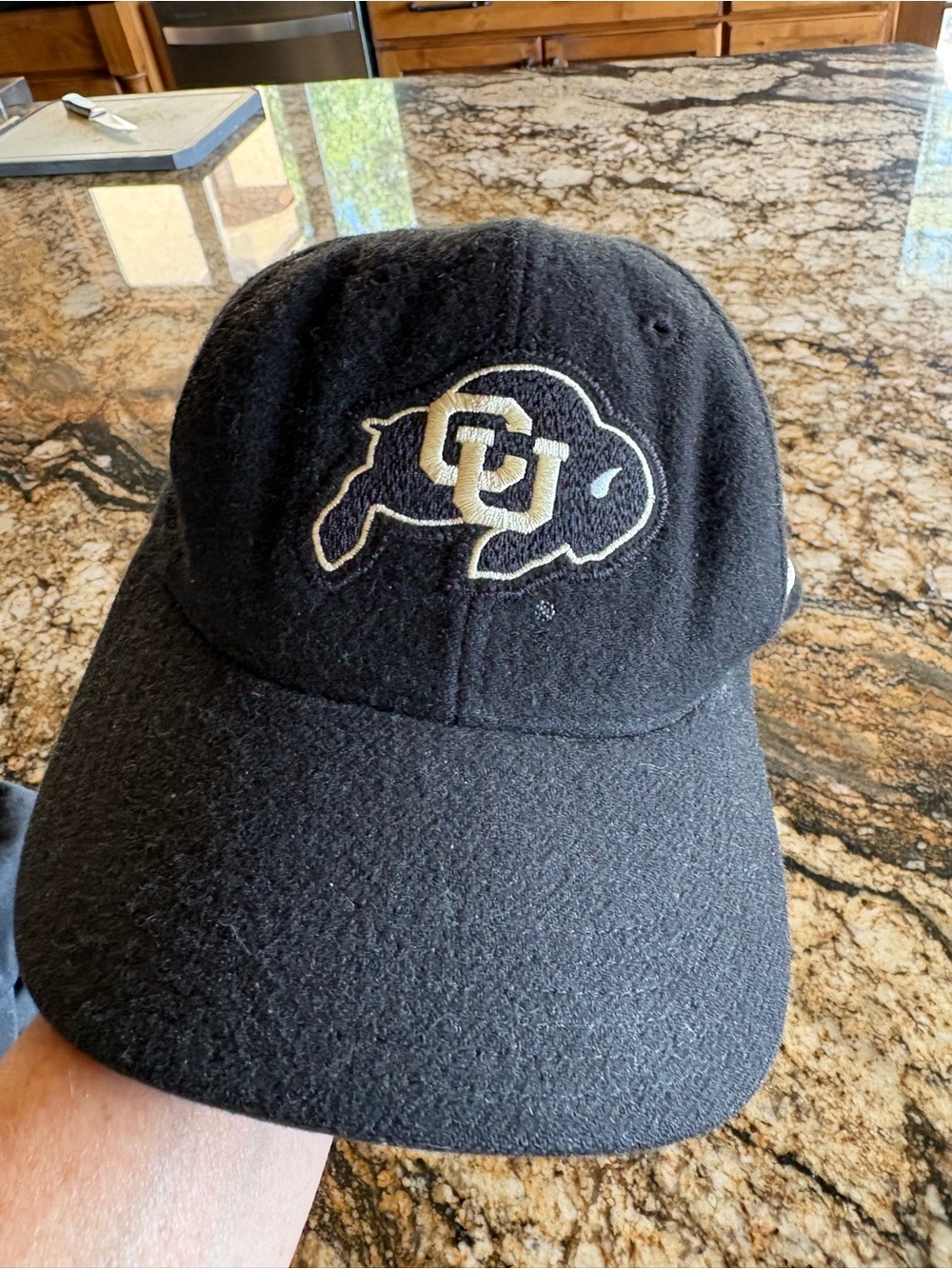 vintage black wool Colorado Buffaloes hat embroidered "CU" buffalo logo.
